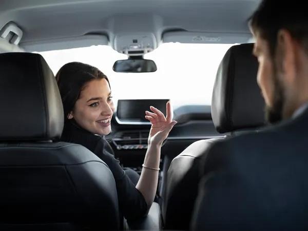 Professional driver assisting passenger